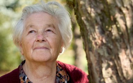 Older woman smiling outdoors