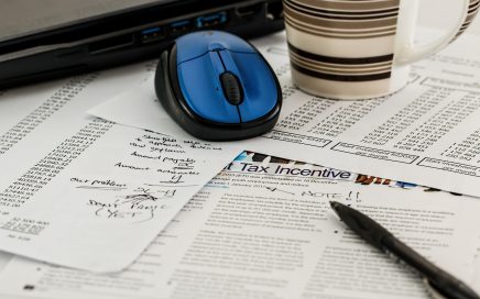 pen, paper, mug and computer mouse